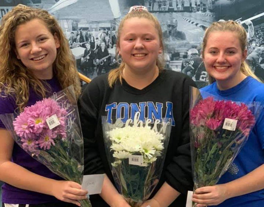 Seniors Emily Larson, Jasmine Ziegenhagen, and Mackenzie Mullenbach are recognized at one of their last cheer practices 