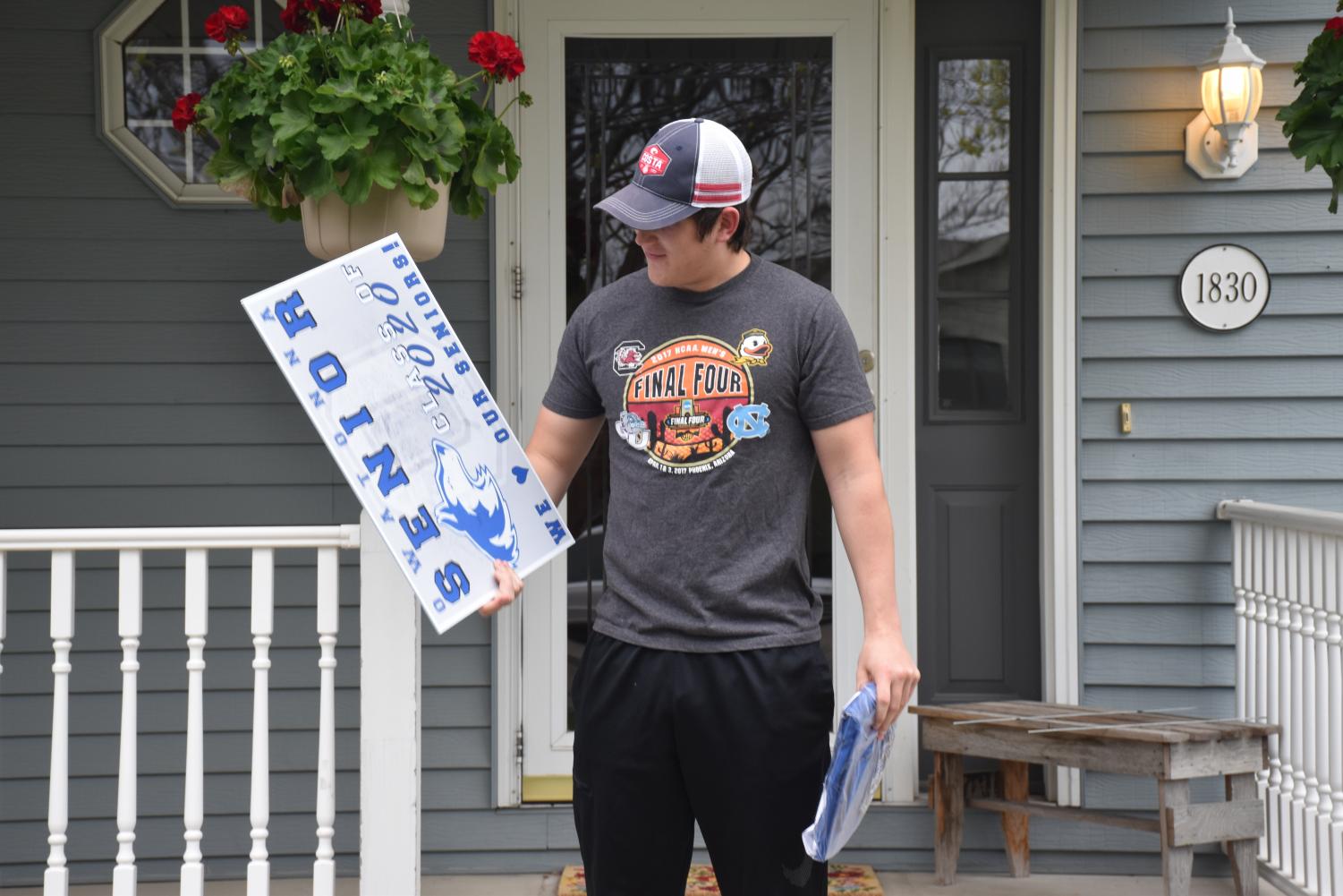 OHS staff hand delivers cap and gowns to the Class of 2020