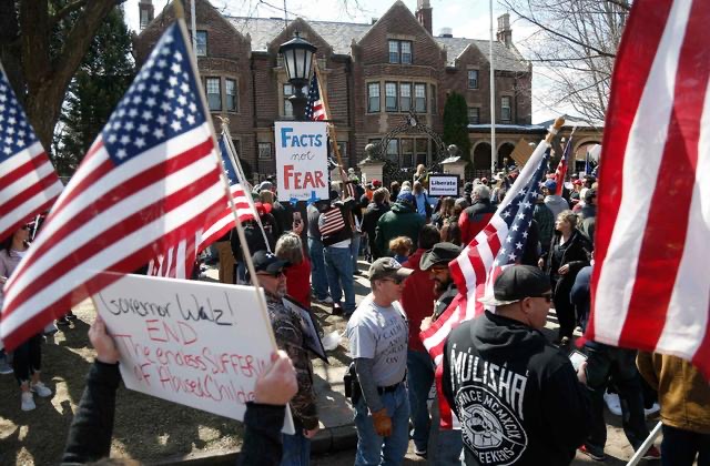 Protesors gather outside of Minnesota Governor Tim Walzs mansion Source: usnews.com