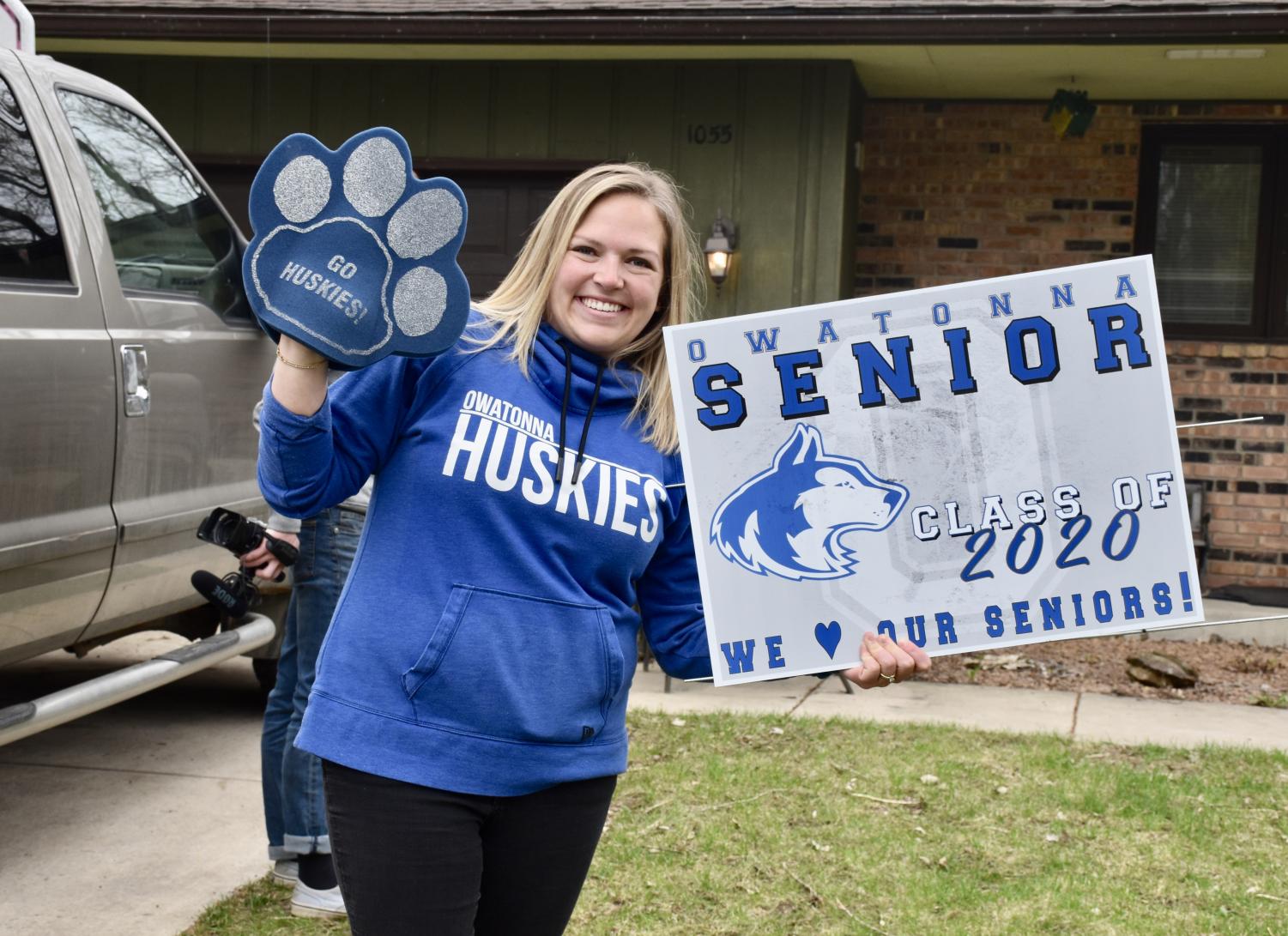 OHS staff hand delivers cap and gowns to the Class of 2020