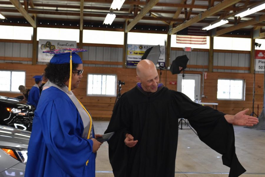 Charity Jackson receiving her diploma from Mr. Kuehn.