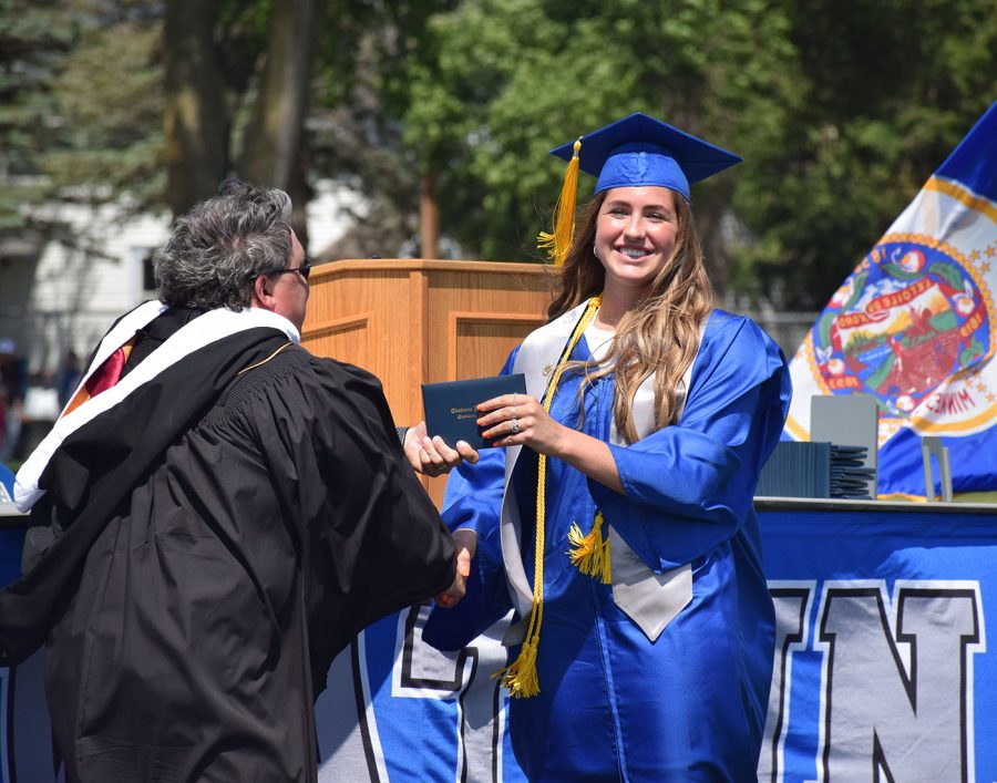 Grace Wolfe accepting her diploma at commencement