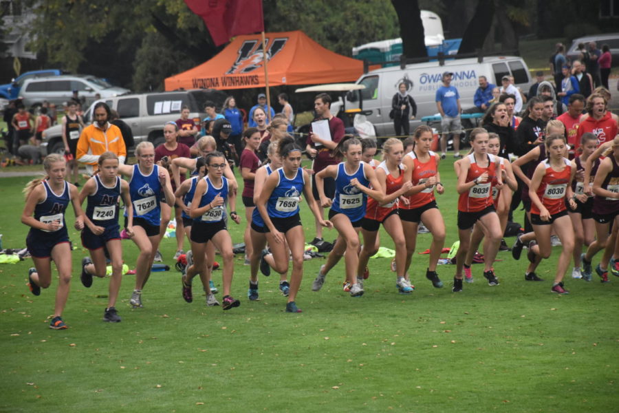 OHS Girls Cross Country team runs together at the beginning of the race.