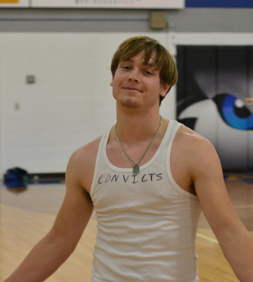 Owatonna Cash Drive, basketball extravaganza participant junior Owen Korbel poses after a win