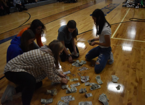 OHS Student Council counts the money raised during the Cash Drive Kickoff Pep Fest.