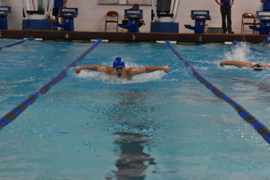 Ryan Peterson swimming butterfly against Northfield.