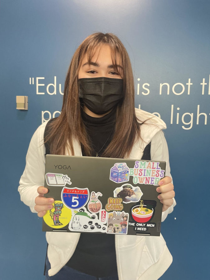 Senior Julia Christenson's laptop shows her wide variety of interests and hobbies, including her small business.