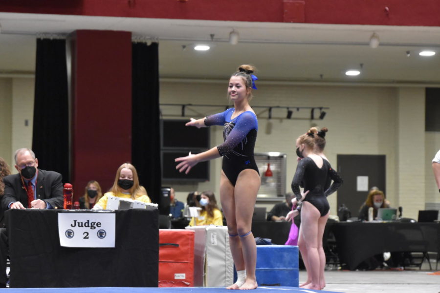Eighth grader Kendra Miller setting for her jumps during her floor routine. 