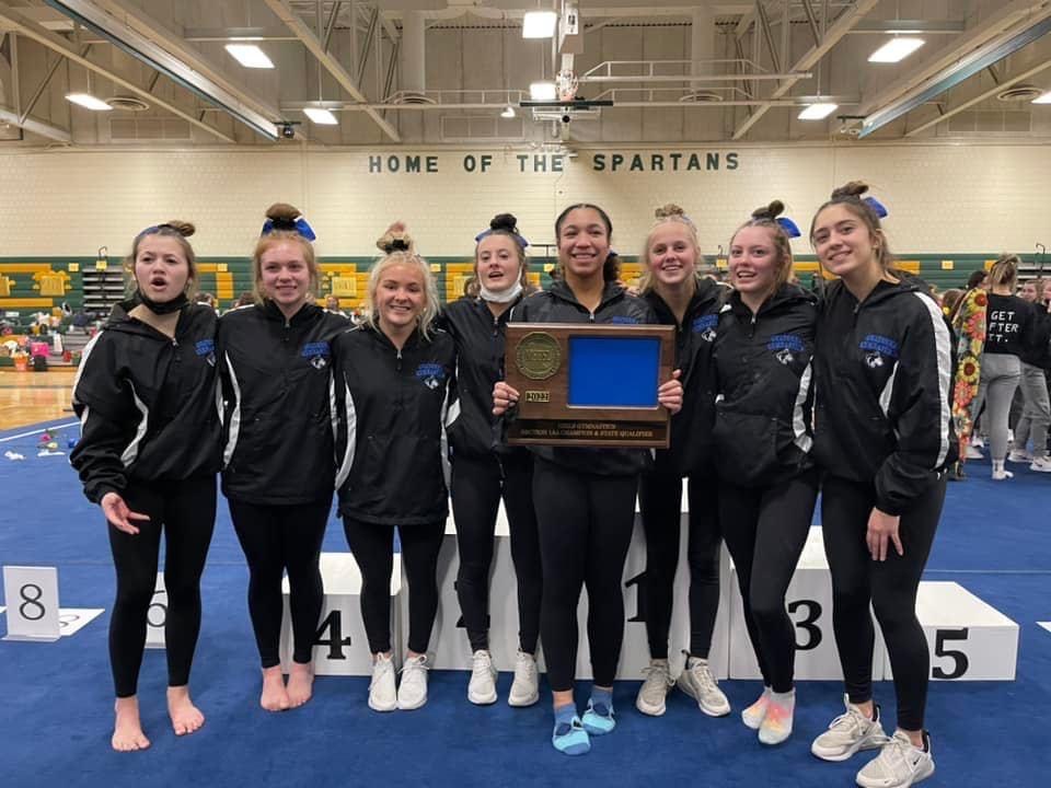 OHS Gymnastics twisting over the competition to earn a trip to state