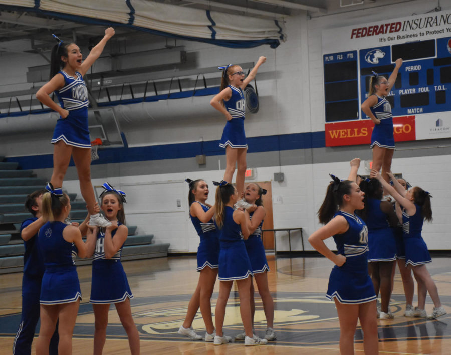 OHS cheerleaders performing at the start of the snow week pepfest.