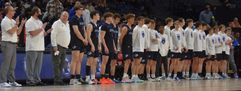 The Owatonna Boys Basketball Team lines up for introductions before the quarter-final game. 