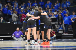 The Owatonna boys basketball teams huddles up before tipoff of Tuesdays game.