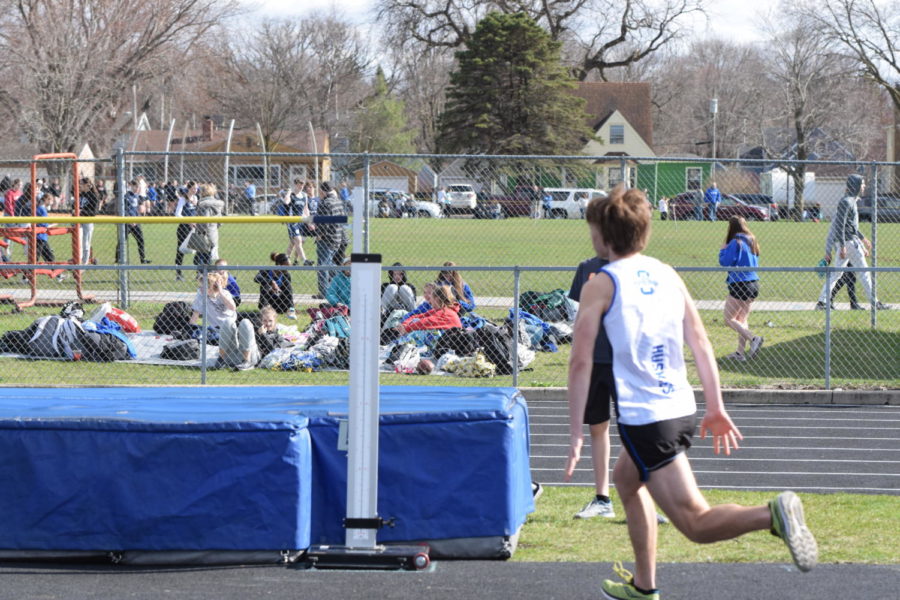 Junior David Smith high jumping his last attempt to receive a good place in the meet. 