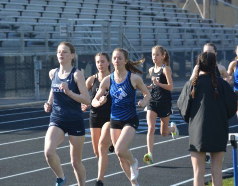 Sophmore Carsyn Brady racing down the track to first place in the 1600m race. 
