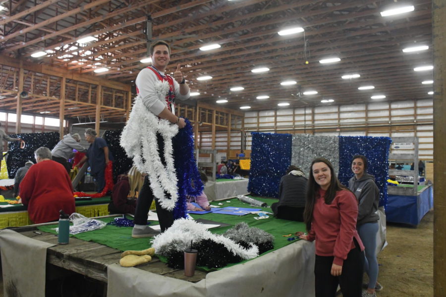 Students and staff from OHS building a float for the homecoming parade 