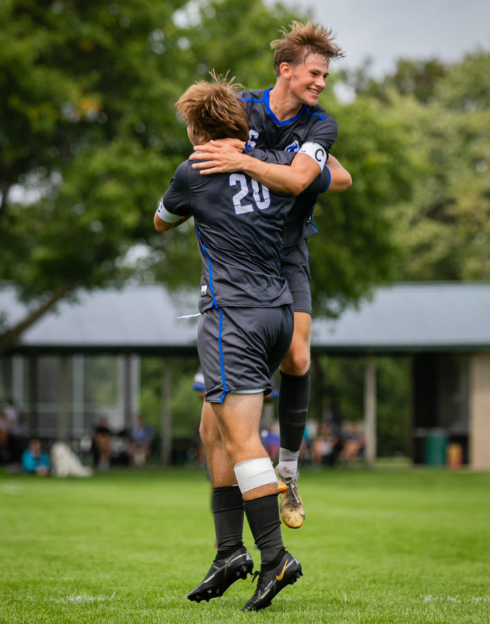 Benny Bangs celebrates with Ty Svenby after he puts the Huskies on top.