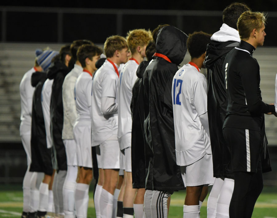 ONE FAMILY. The Owatonna Boys Soccer team lines up together after the game to receive their medals.