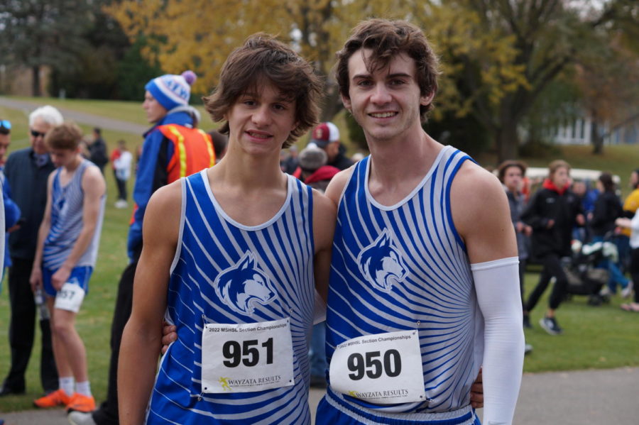 Brothers Trey and Trevor Hiatt smiling for picture after running section meet together. 