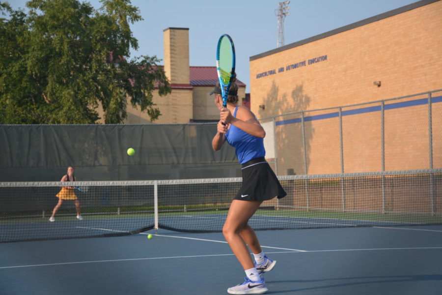 Girls tennis captain Olivia McDermott swinging back at the Mankato East player. 
