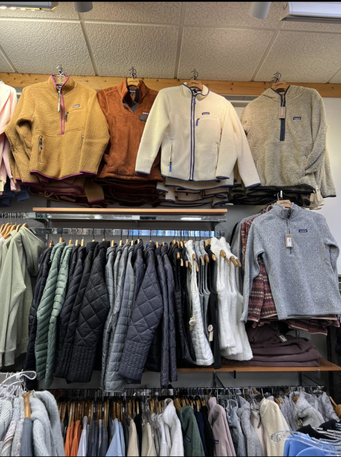 Patagonia sweaters hanging up in GILKS a local boutique in Hayward, WI.