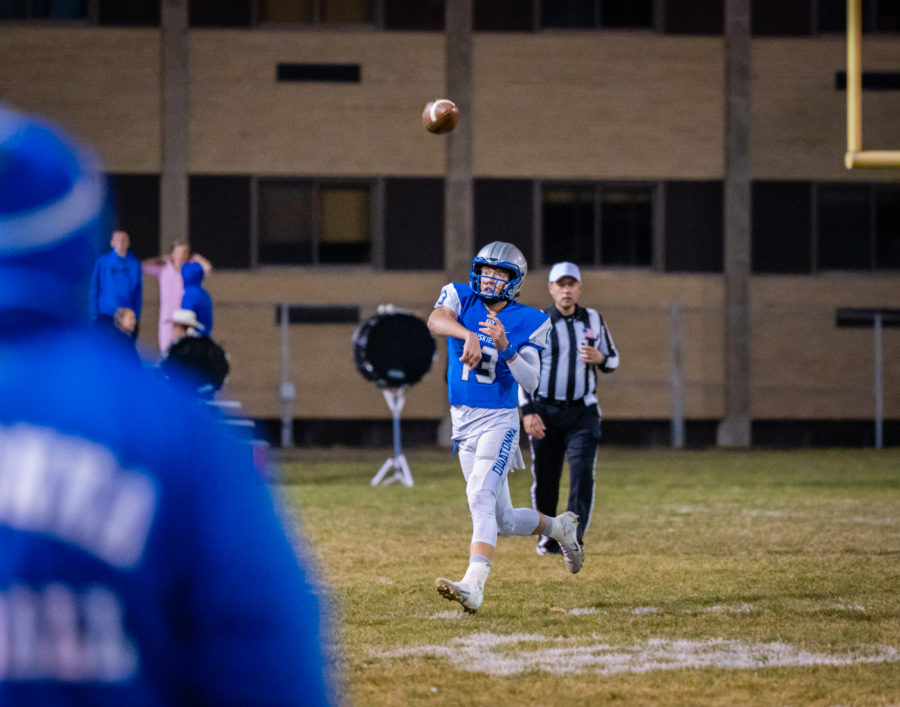 LOCKED IN. Junior quarterback Jacob Ginskey throws a spiral down the field.