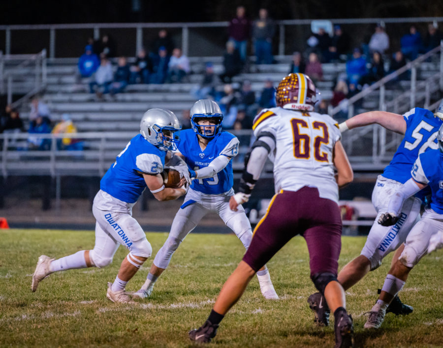 GREMSWORTH. Junior Jacob Ginskey handing the ball off to Senior Conner Grems.