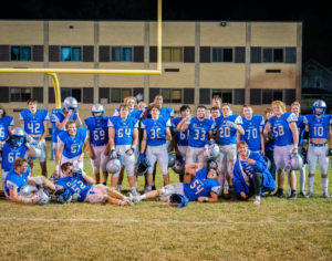 ONE LAST TIME. Owatonna Football team lines up for a photo one last time on the OHS Football Field.