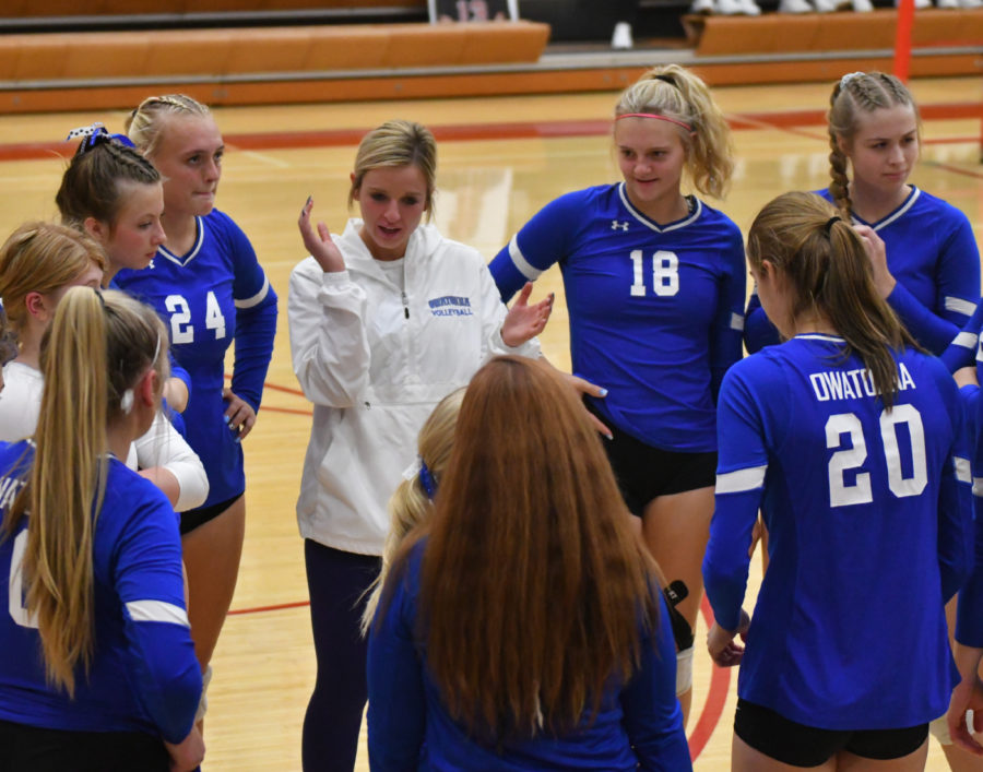 TIME OUT. The Owatonna Volleyball team circles up during their time out to discuss the game.