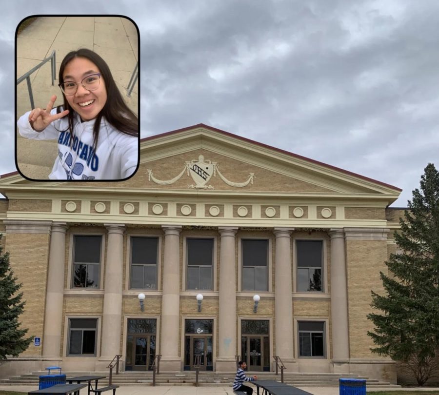 Senior Kassidy Hart poses for a BeReal in front of OHS.