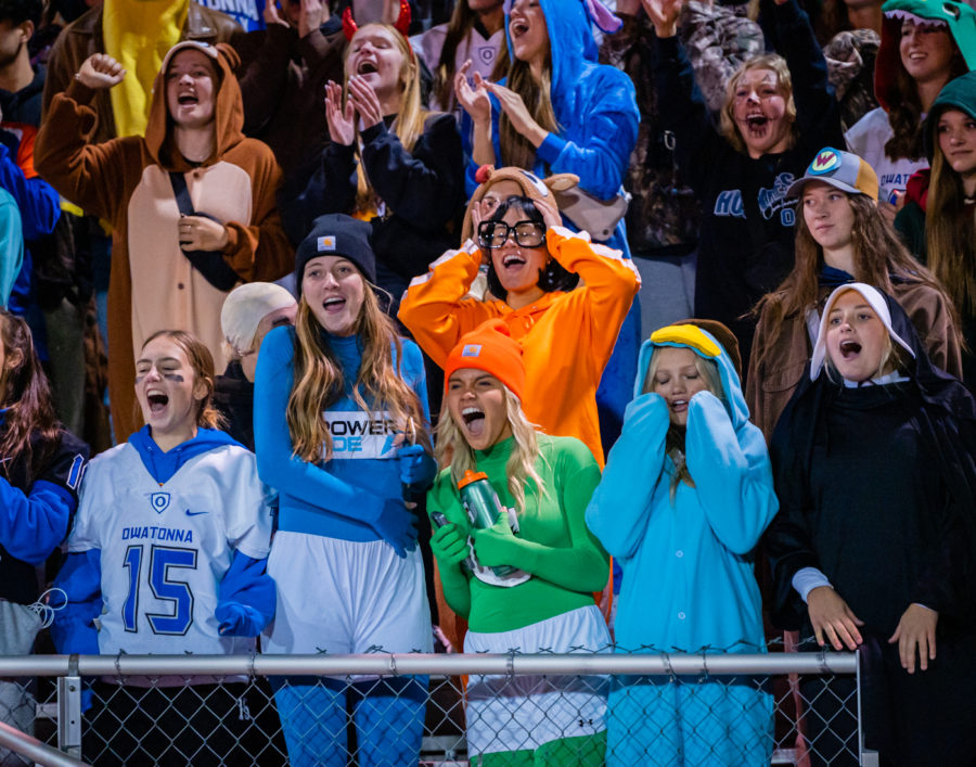 HALLOWEEN. Owatonna student section celebrating the game winning touchdown in their Halloween costumes.