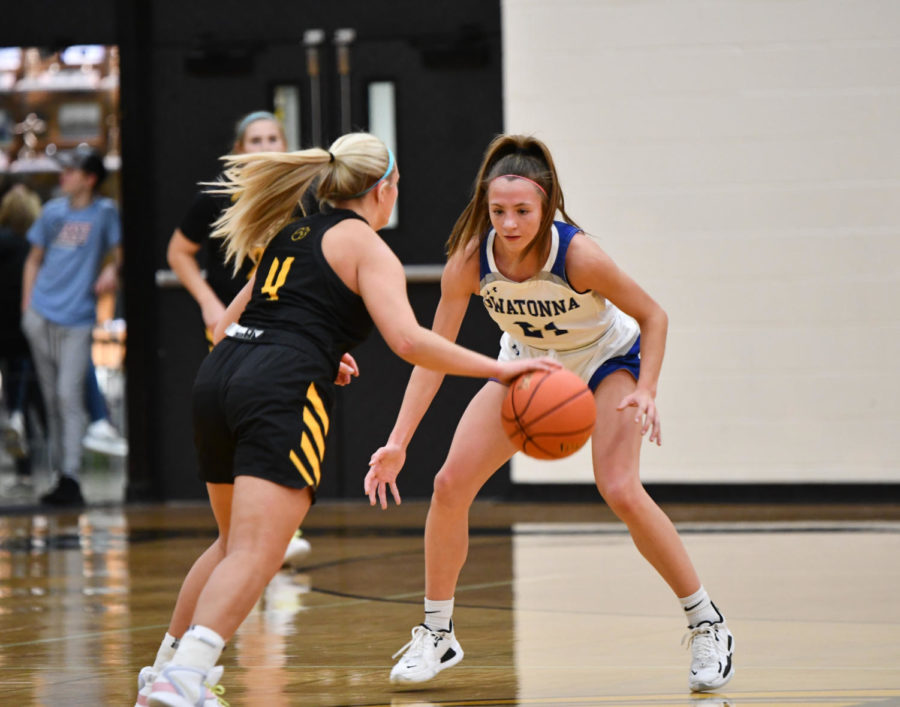 DEFENSE. Junior Carsyn Brady ready to get the ball back from the Mankato East player.
