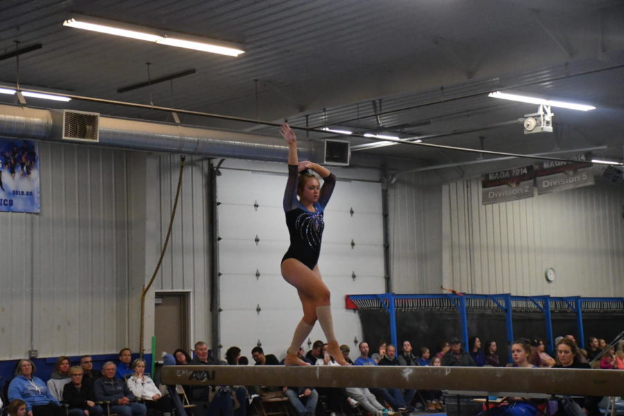 Sophomore Averie Roush poses during her beam routine at the home dual meet on Jan. 27.