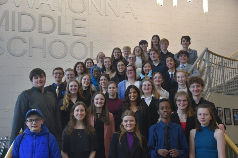 The Owatonna Speech Team proudly poses for a team photo after their home meet.