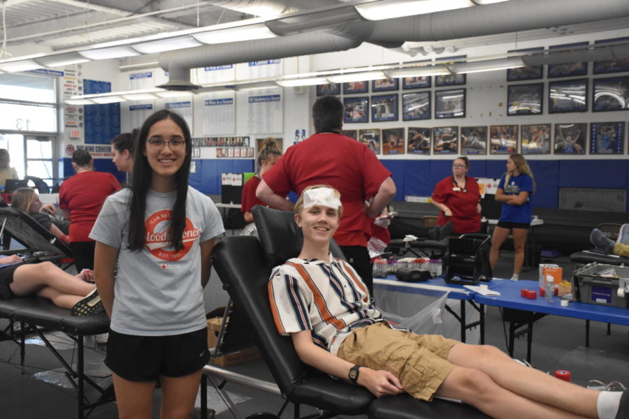 NHS+blood+drive+commissioner+Lileigh+Nguyen+posing+for+a+picture+with+a+blood+donor.+