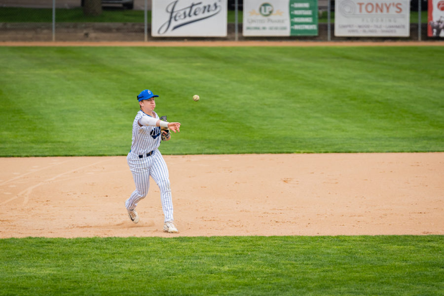 Junior Captain Mitch Seykora fields the ball and throws the ball across to first base.