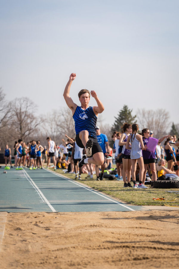 Sophomore Jamie Lisowski soars through the air at the Faribault meet.