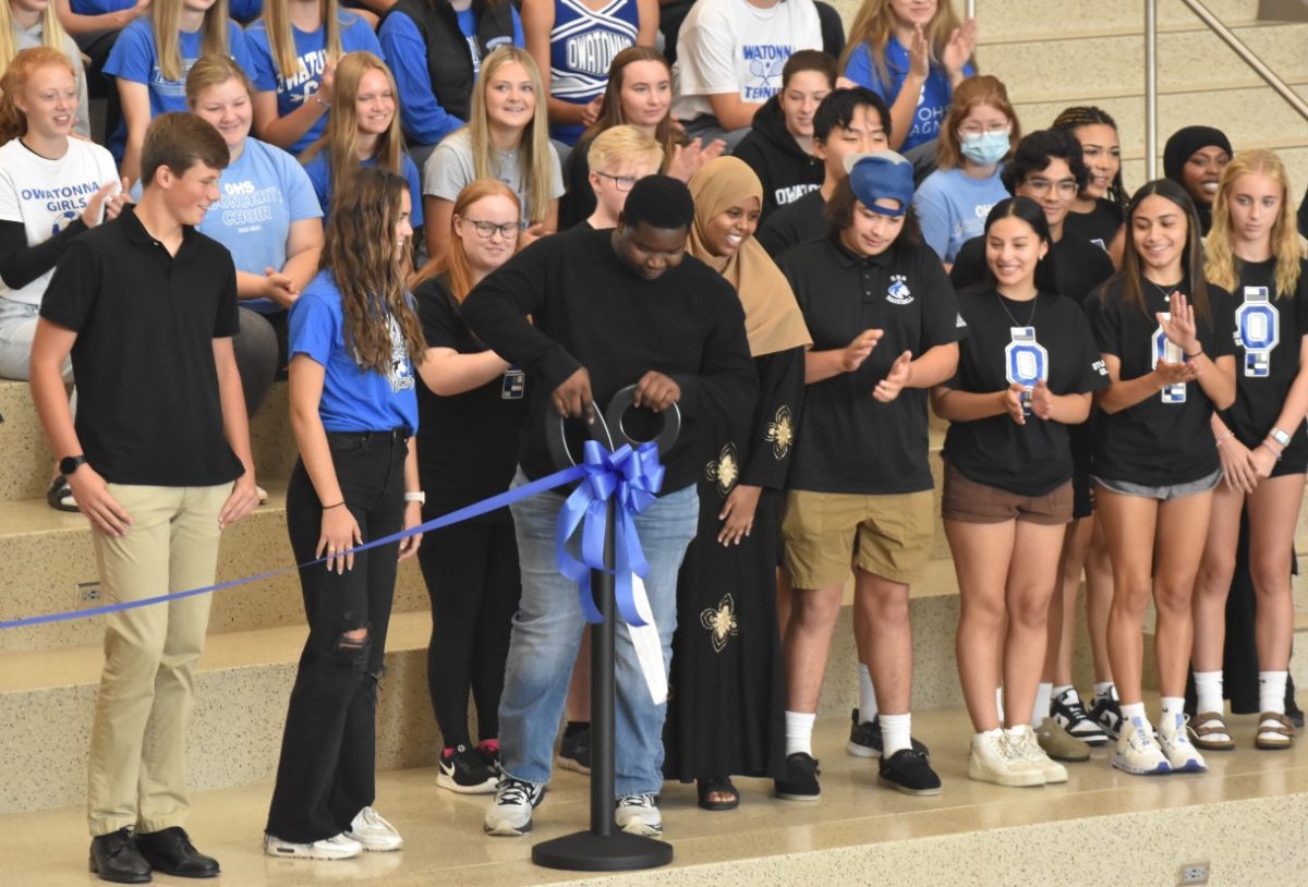 Senior Donte Miller initiates the new OHS by ribbon-cutting. 