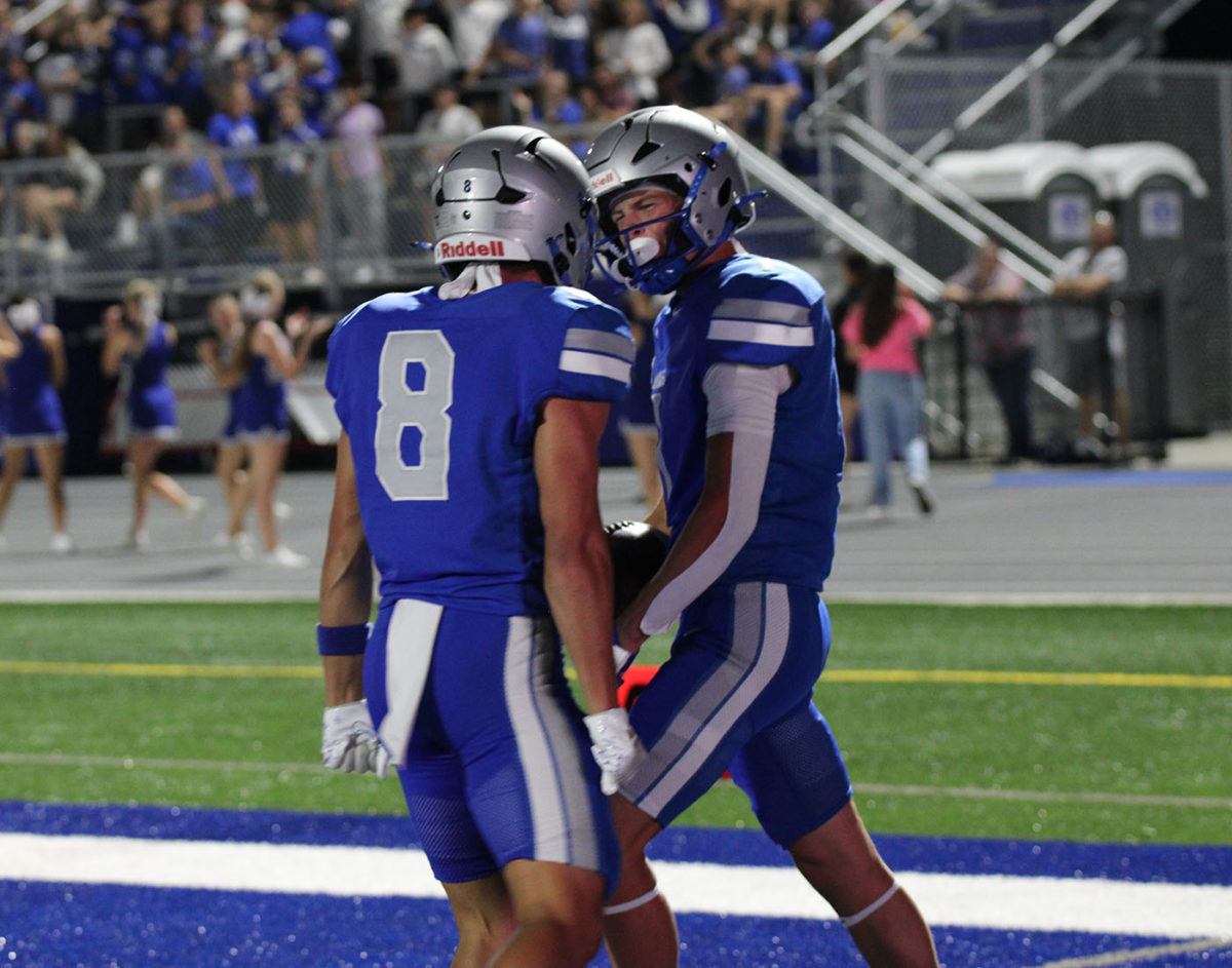 Seniors Owen Beyer and Caleb Hullopeter celebrate after Beyers touchdown.