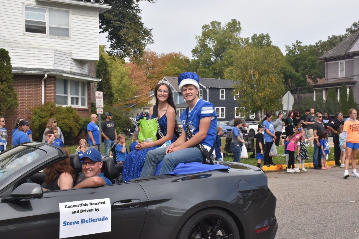 Homecoming Queen Anna Cox and King Jacob Ginskey going through the parade.