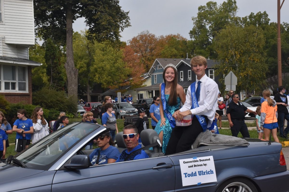 Top 5 Candidates Elizabeth Radel and Henry Hilgendorf going through the parade.