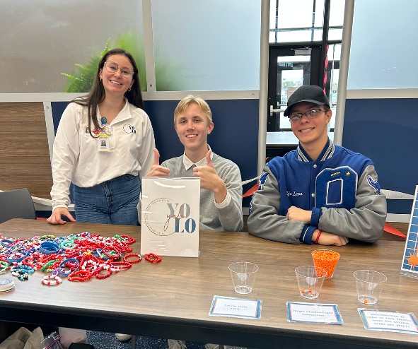 OHS SHOC members handing out red bracelets for Red Ribbon Week.