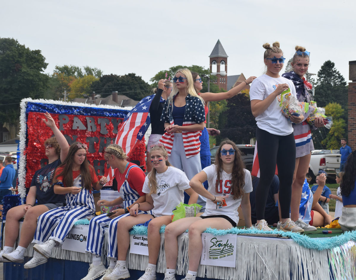 OHS Girls Volleyball Team going through the homecoming parade