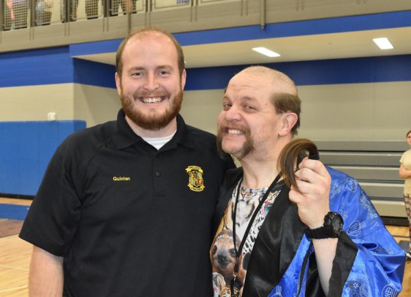 Officer Quinian and Student supervisor, Mr. Noble show bright smiles for Nobles new hair cut. 