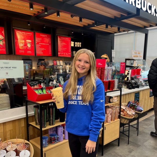 Emily Mcmasters enjoying her holiday drink from Starbucks. 