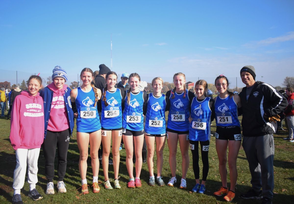 OHS+girls+cross+country+team+poses+for+a+picture+together+after+the+race.