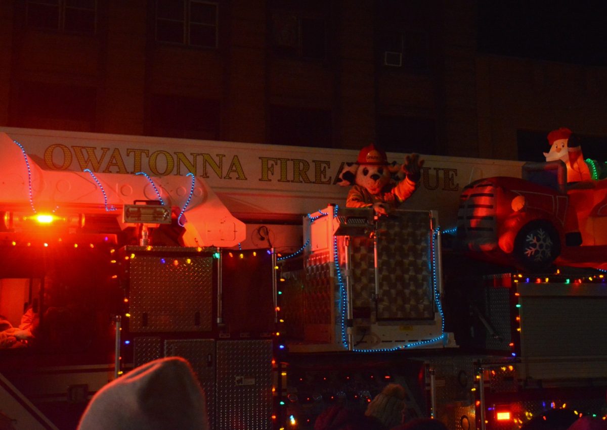 Owatonna Fire Department decorates a firetruck with lights for the Holiday Parade. 