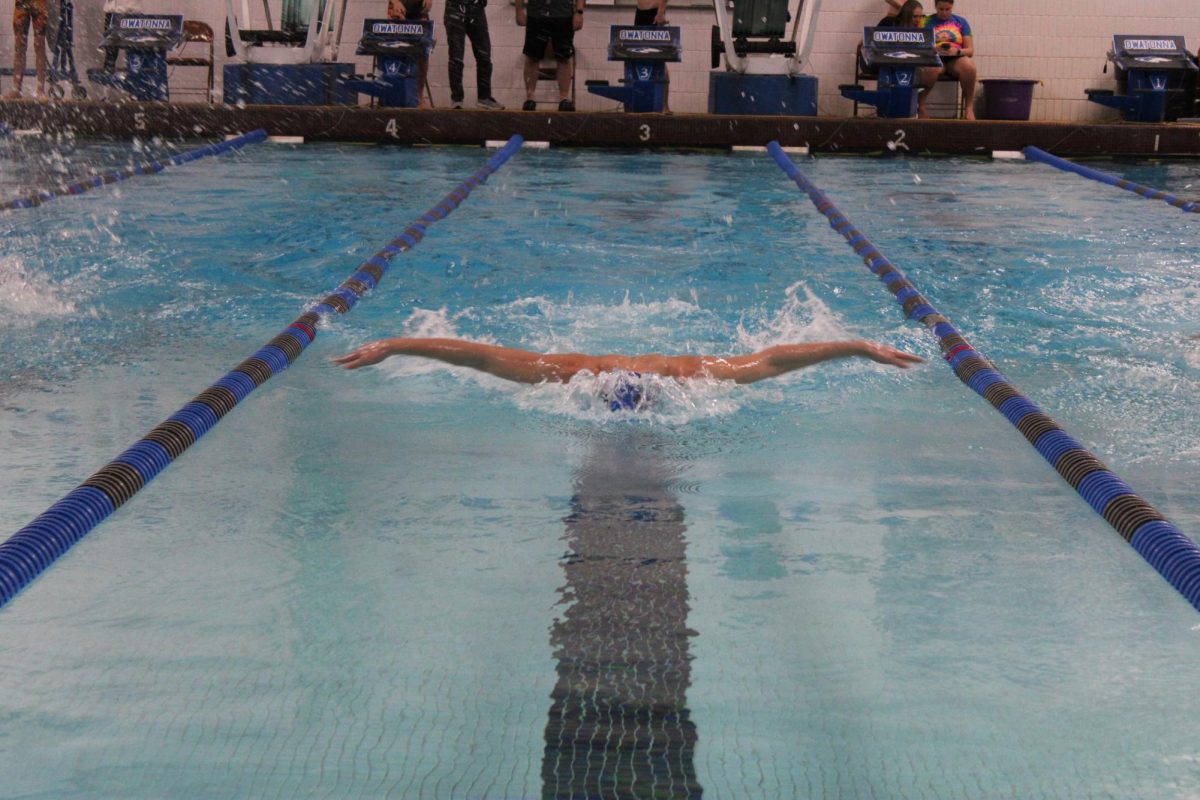 Sophomore, Addison Young doing the butterfly at a home meet. 