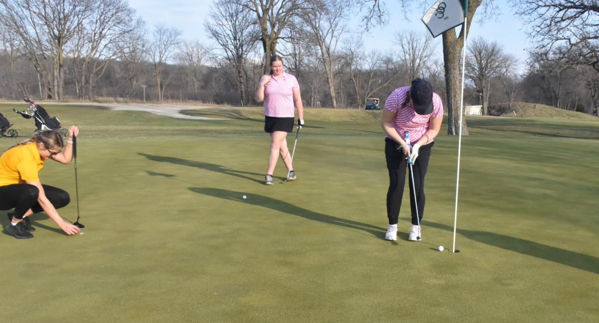 Alexie Olson putts in during a home tournament. 