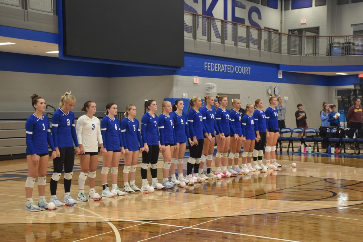 OHS girls volleyball lined up for national anthem. 