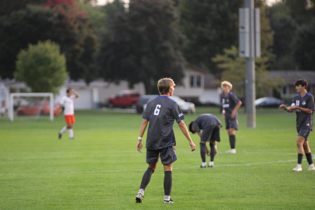 Senior Kellen Katzung prepares after subs enter the field. 